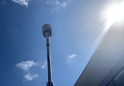 Magellan MX500 Weather Station against a blue sky.