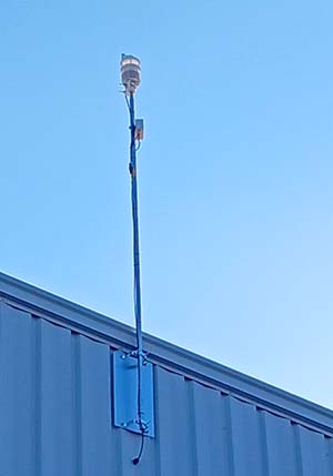 Pulsar 800™ Weather Station mounted on the side of a building