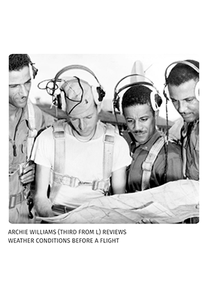 Archie reviews weather conditions with pilots before a flight.